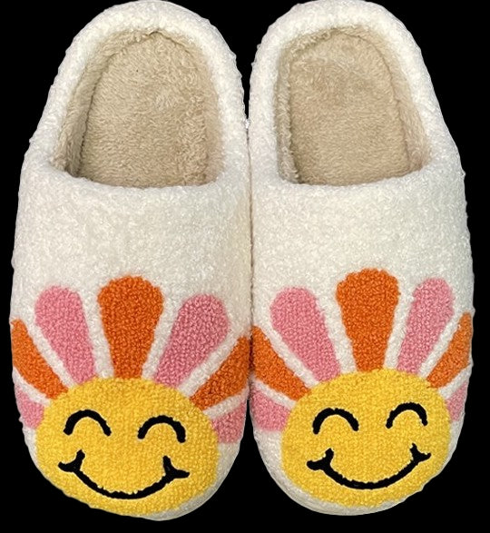 Pair of white slippers with sunflower designs on a white background