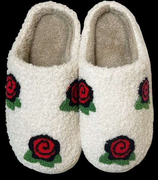 White slippers with red rose designs on a white background