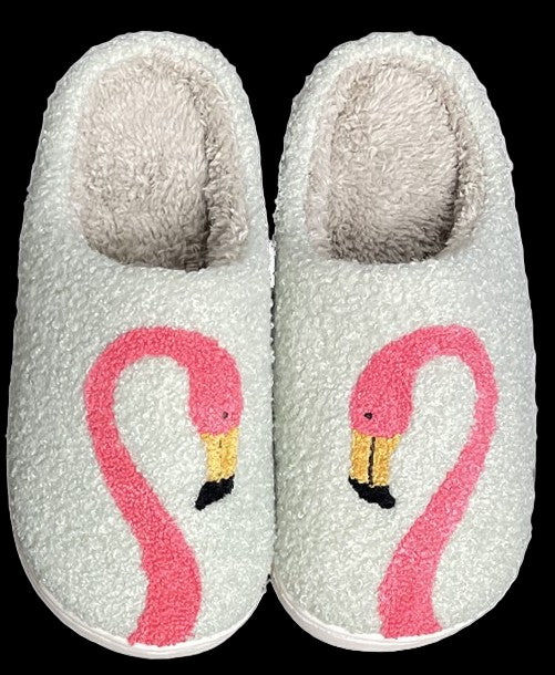 Pair of gray slippers with pink flamingo design on a white background