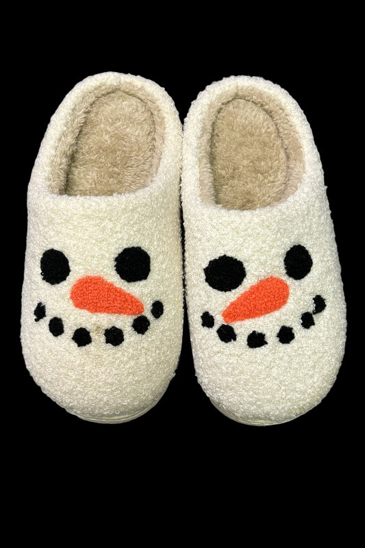 Pair of cream-colored slippers with a snowman face design on a white background