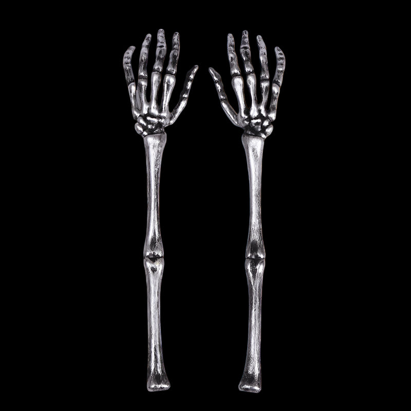 Two skeleton hand forks on a white background