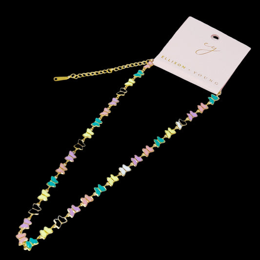 Colorful necklace with a gold chain on a light gray background, featuring a pink card with 'Elison + Young' branding.