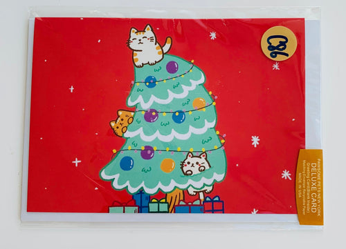 Card with a Christmas tree design featuring cats on a red background