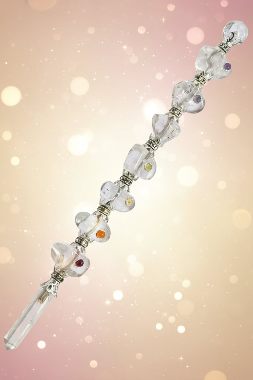 Silver bracelet with heart designs on a white background