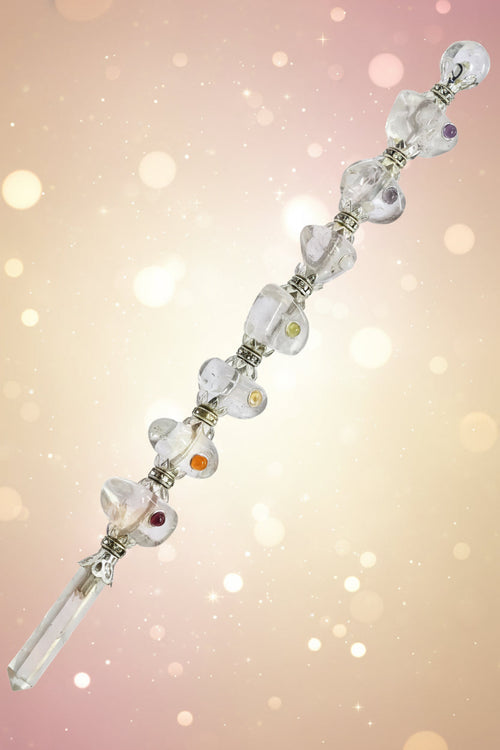 Silver bracelet with heart designs on a white background