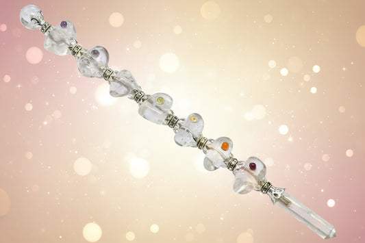 Silver bracelet with heart designs on a white background