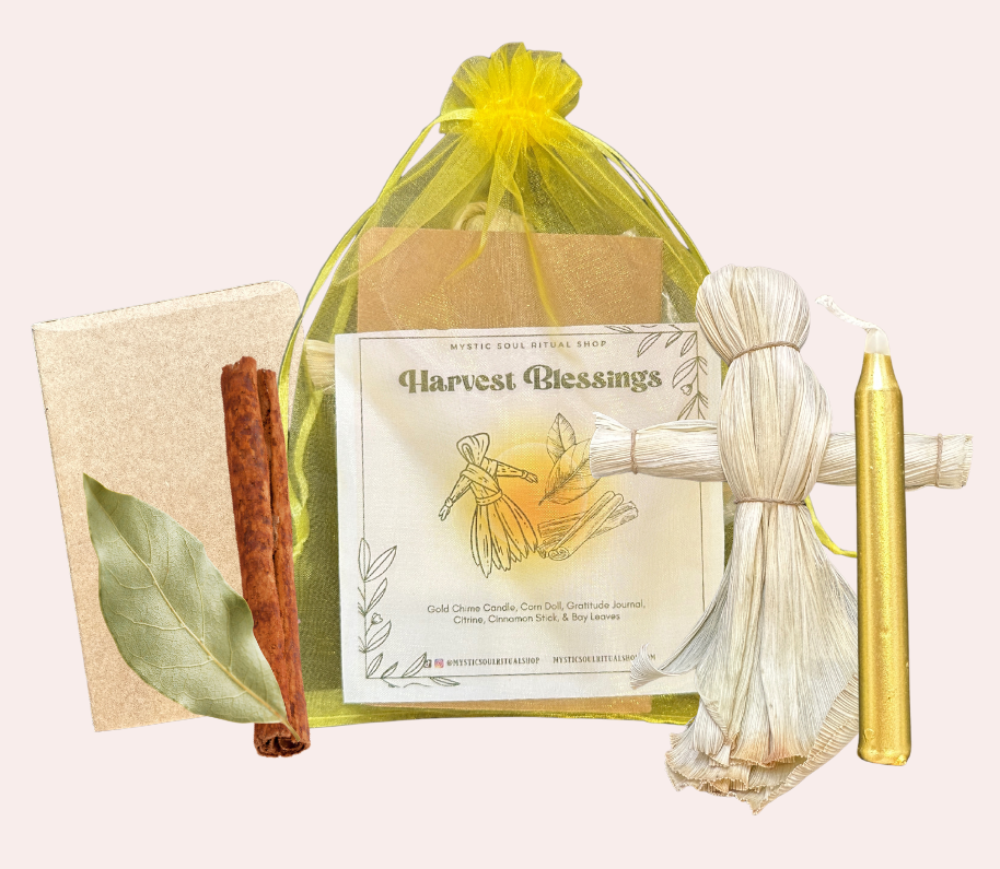 Harvest-themed gift set with candle, cinnamon stick, and decorative items on a white background