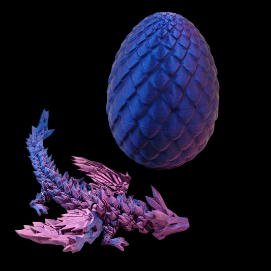 Blue dragon egg and dragon model on a pink background