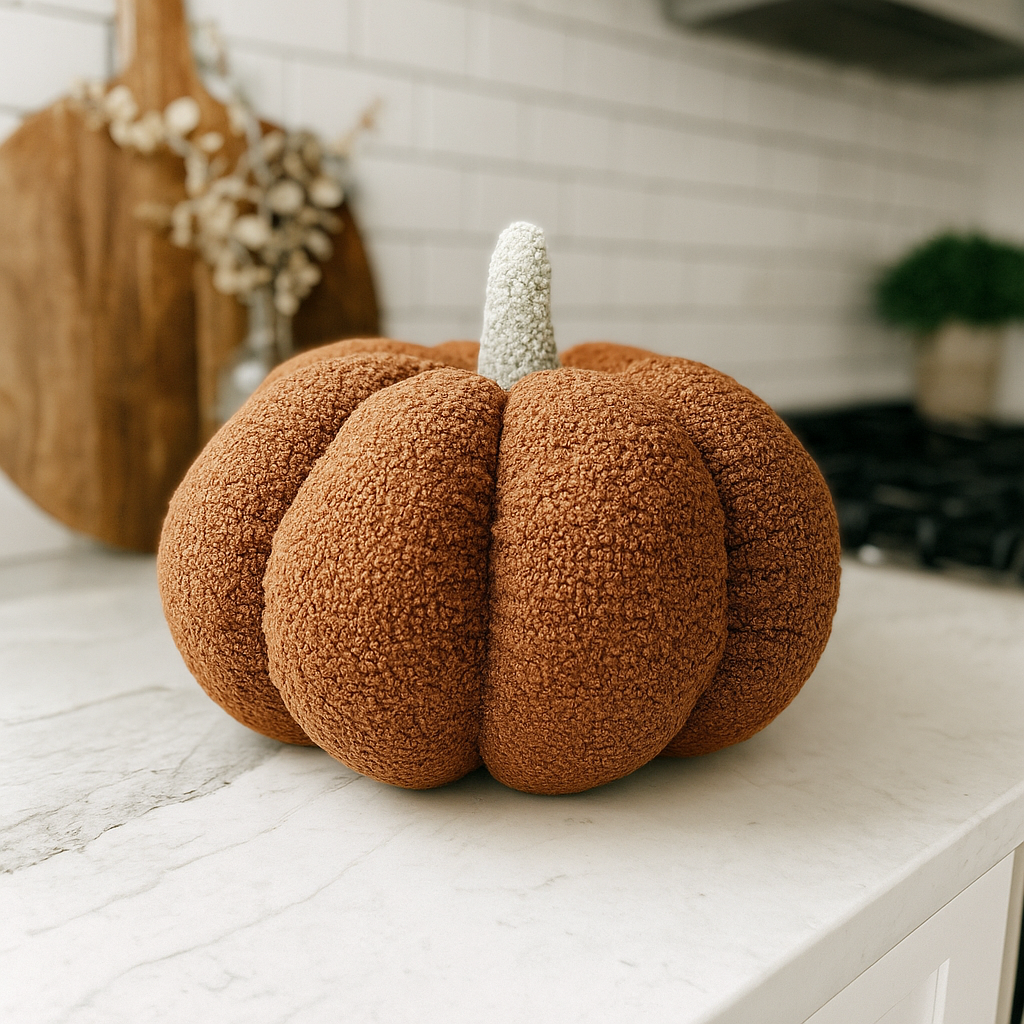 Textured brown pumpkin decoration on a white surface with a neutral background