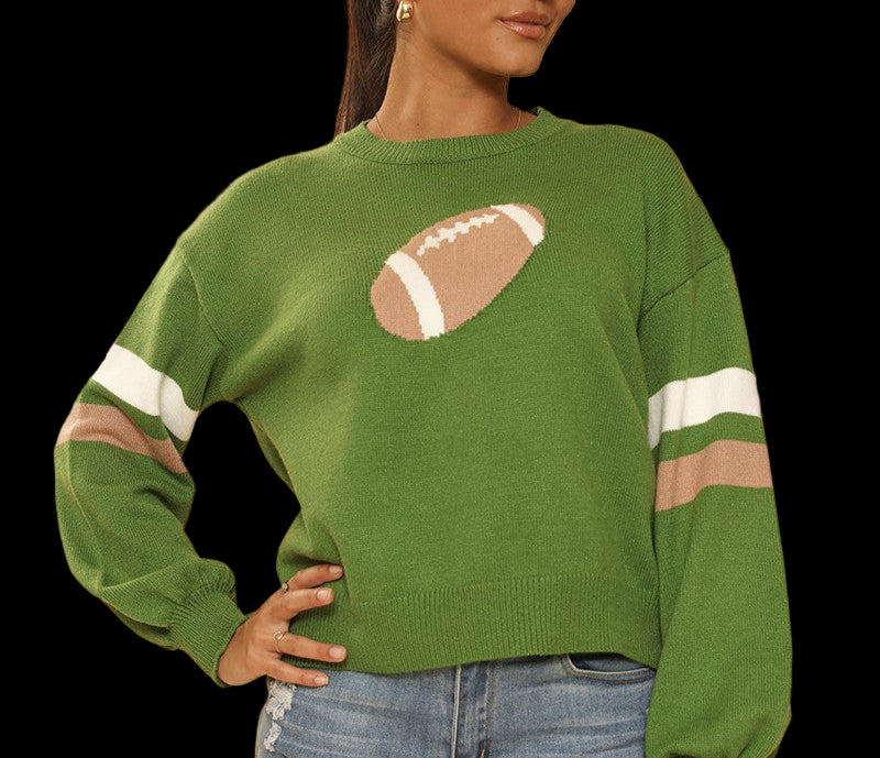Woman wearing a green sweater with a football design on a beige background