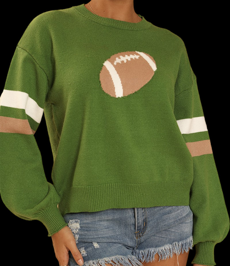 Green sweater with football design and white stripes on a beige background