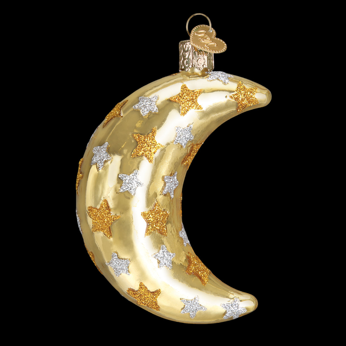 Gold glass ornament shaped like a crescent moon with star designs on a white background