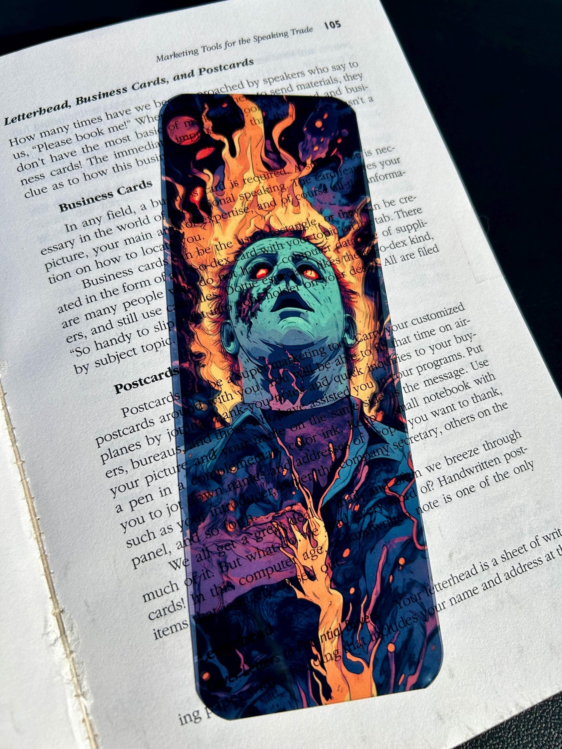 Artistic bookmark with a fiery design on an open book