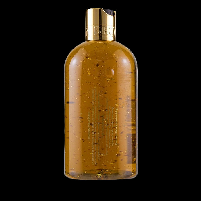 Brown bottle with gold cap on a white background