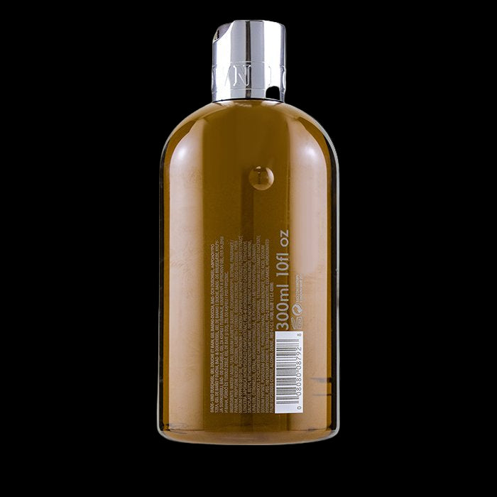 Brown bottle with silver cap on a white background