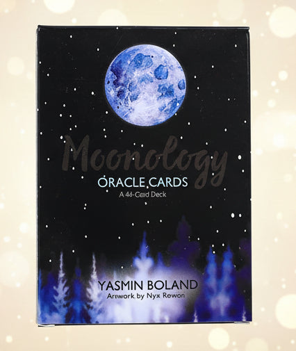 Box of Moonology Oracle Cards with a blue moon illustration on a black background