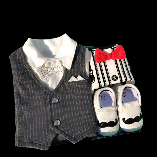 Baby boy outfit set with vest, shoes, and socks in a box.