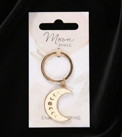 Gold moon phase keychain on a white card with 'Moon Phase' text