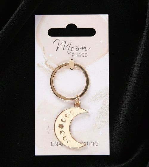 Gold moon phase keychain on a white card with 'Moon Phase' text