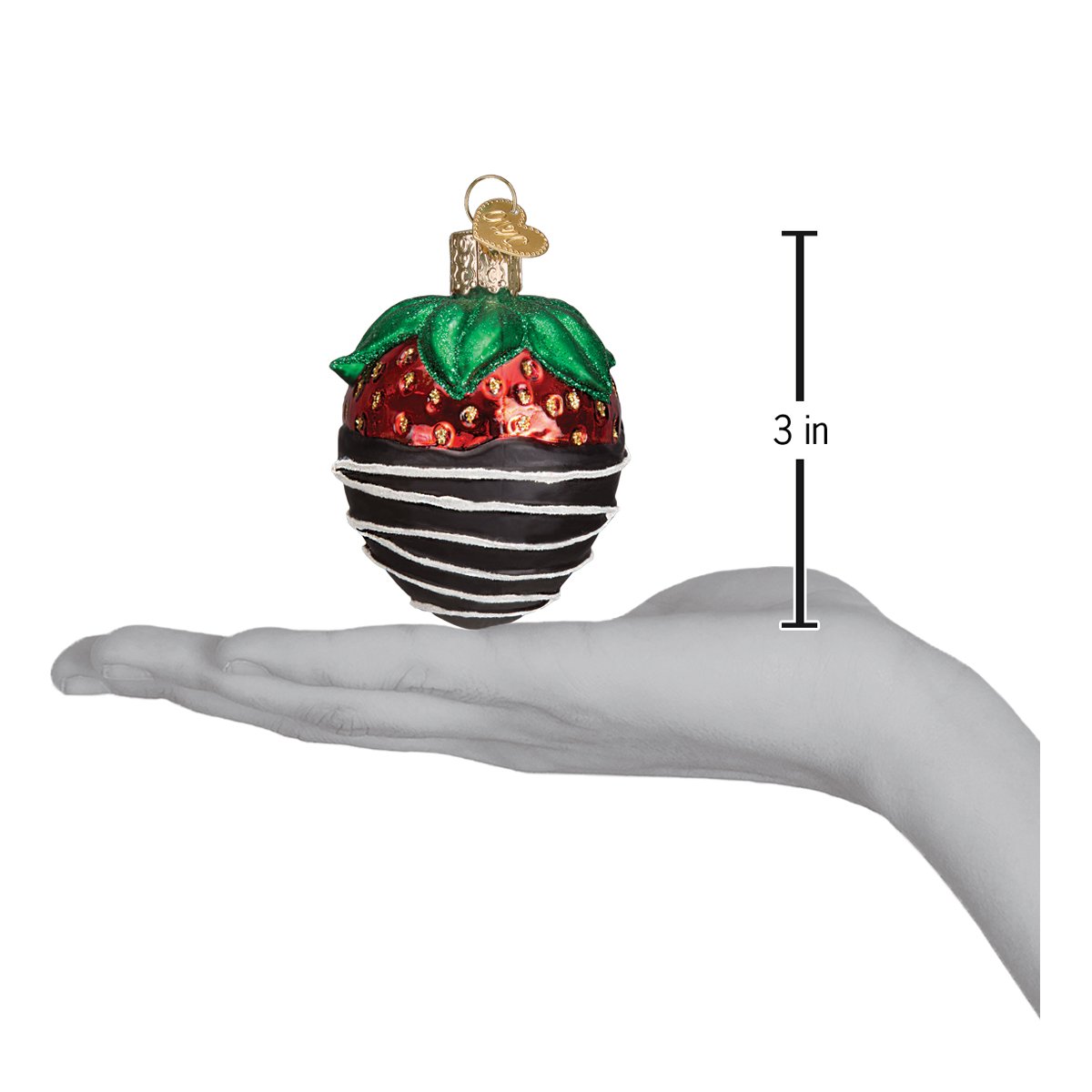 Decorative glass ornament resembling a strawberry held in a hand with a measurement indicator showing it is 3 inches tall.