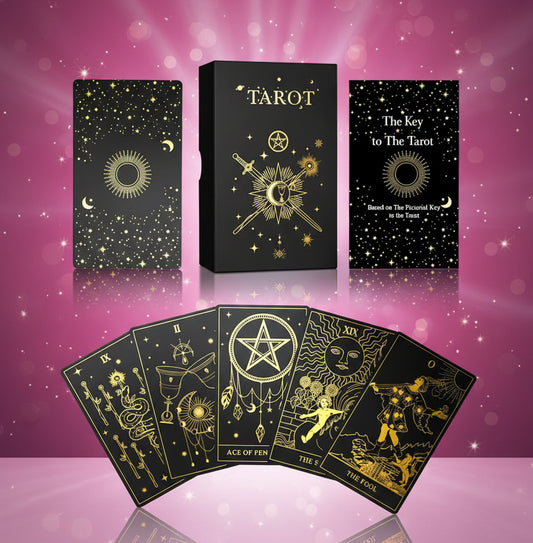 Tarot card set with black and gold design on a white background