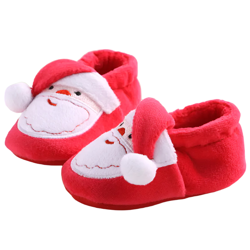 Red baby shoes with Santa Claus design on a light background