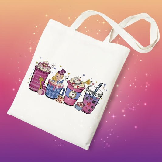 White tote bag with colorful illustrations of mugs and a character on a white background