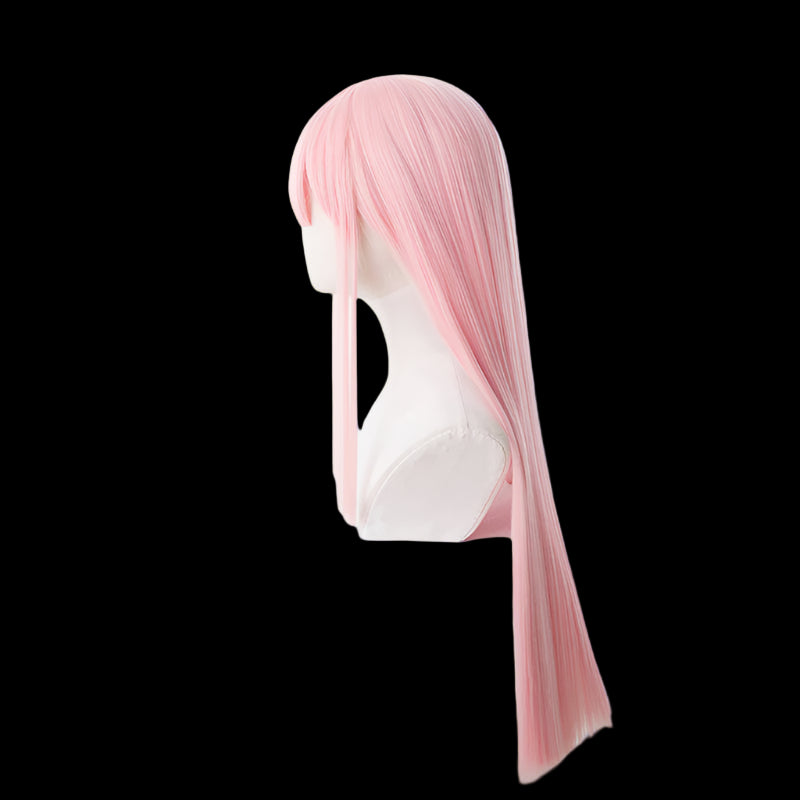 Pink wig on a mannequin head against a white background