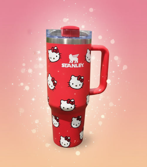 Red Stanley tumbler with Hello Kitty designs on a white background