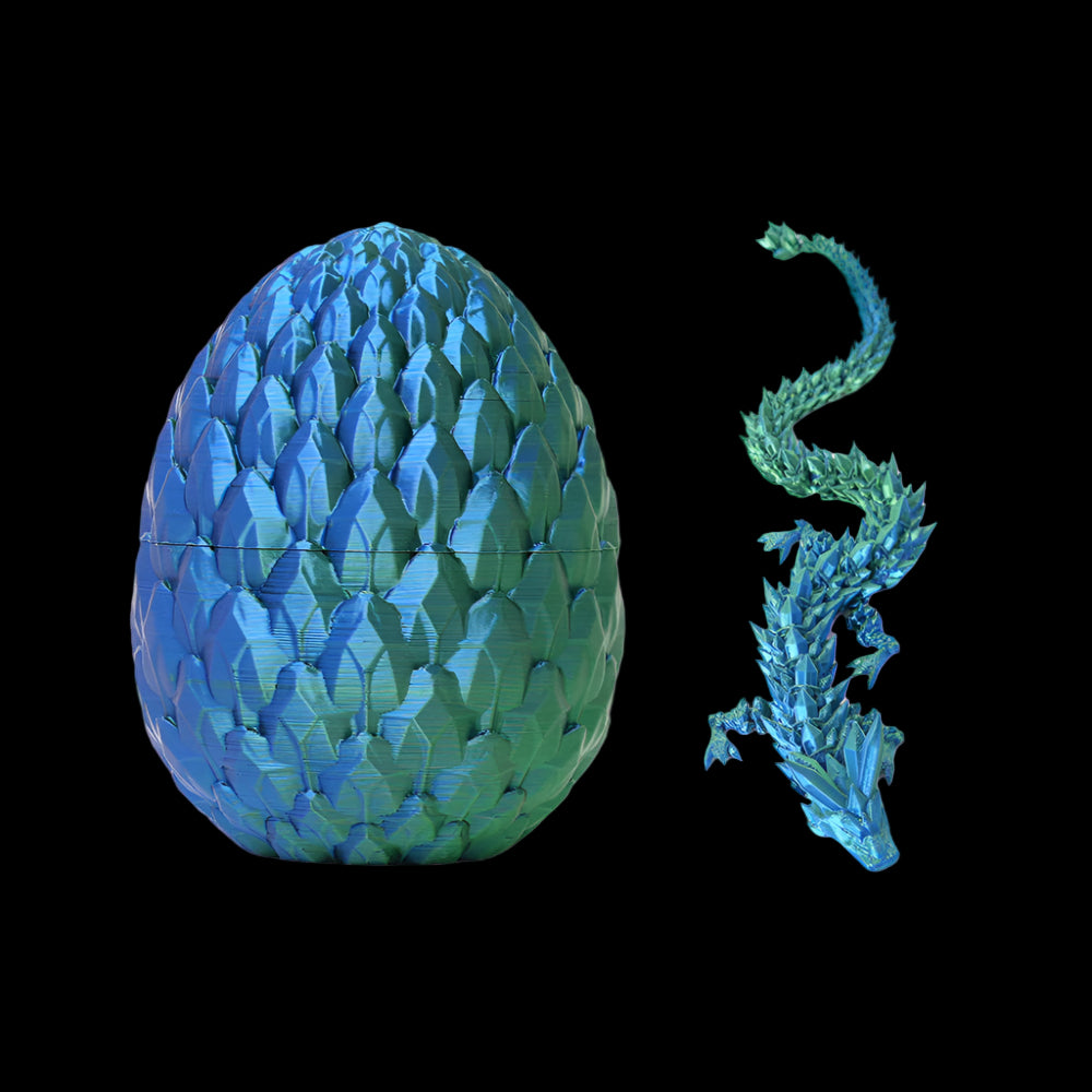 Blue and green dragon egg with a small dragon emerging on a white background