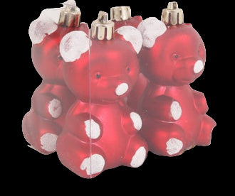 Red bear-shaped ornaments with white spots in a clear box on a light gray background