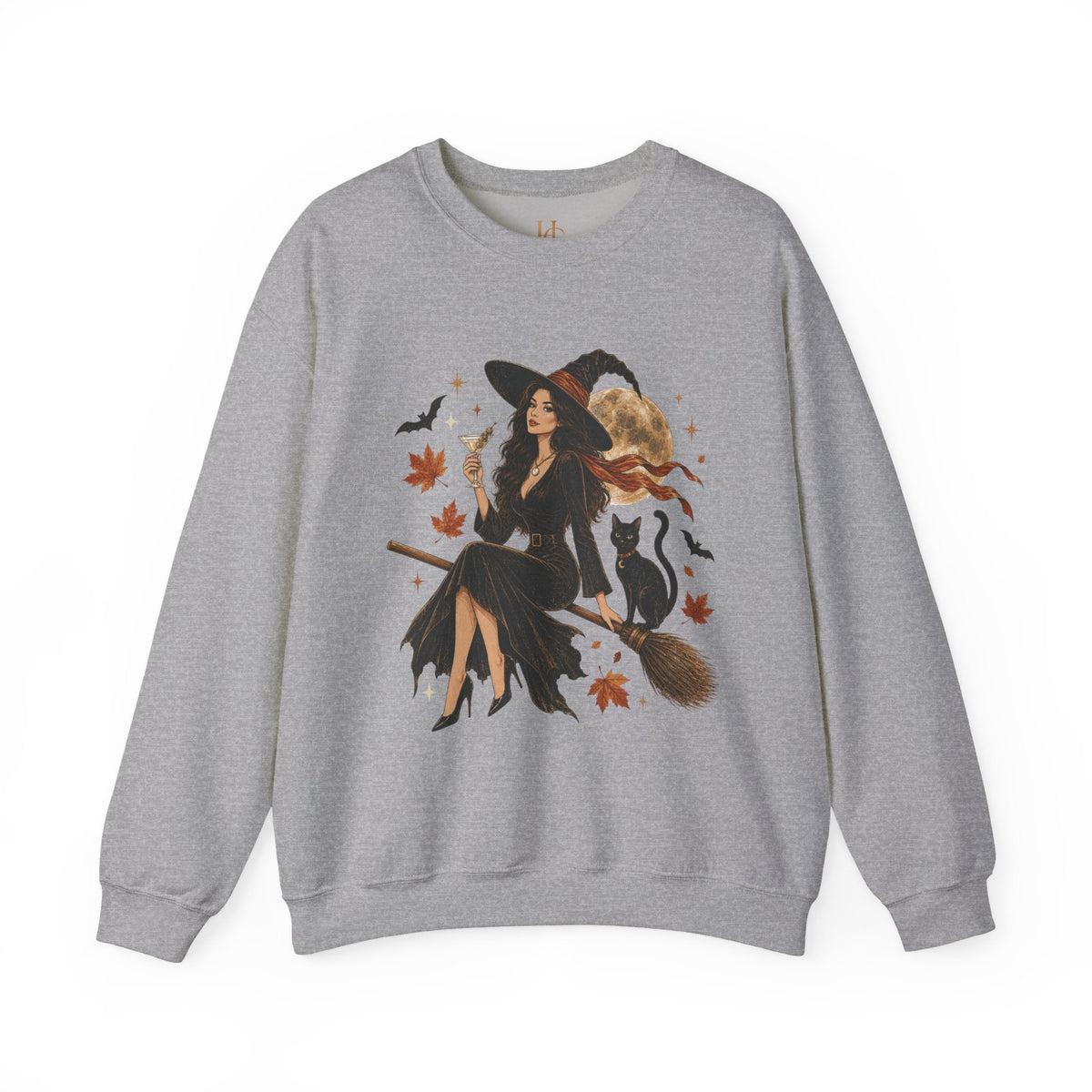 A heather gray crewneck sweatshirt featuring a large graphic print of a witch riding a broomstick with a black cat, surrounded by autumn leaves and bats.