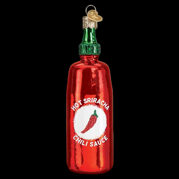 Decorative glass bottle ornament of a red Hot Sriracha chili sauce bottle on a white background