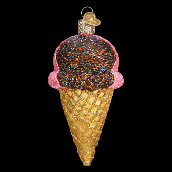 Decorative ice cream cone ornament with brown and pink ice cream on a white background