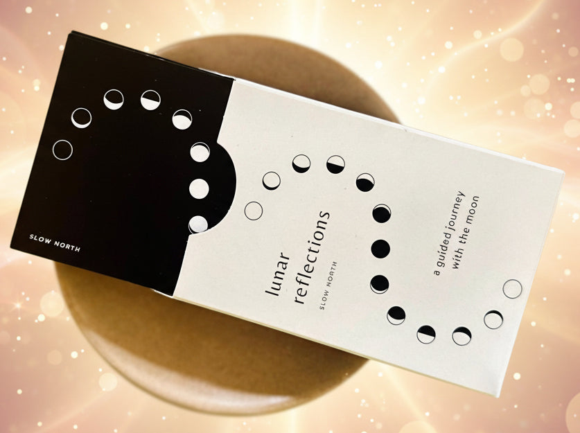 Product packaging with 'Lunar Reflections' text on a wooden surface