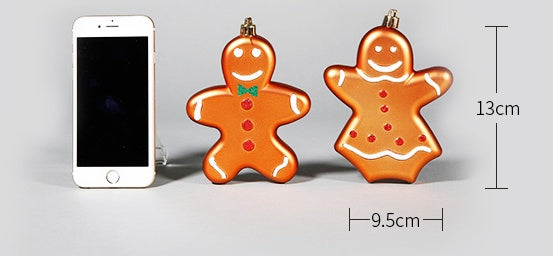 Two gingerbread man-shaped phone chargers next to a smartphone on a gray background with measurements indicated.