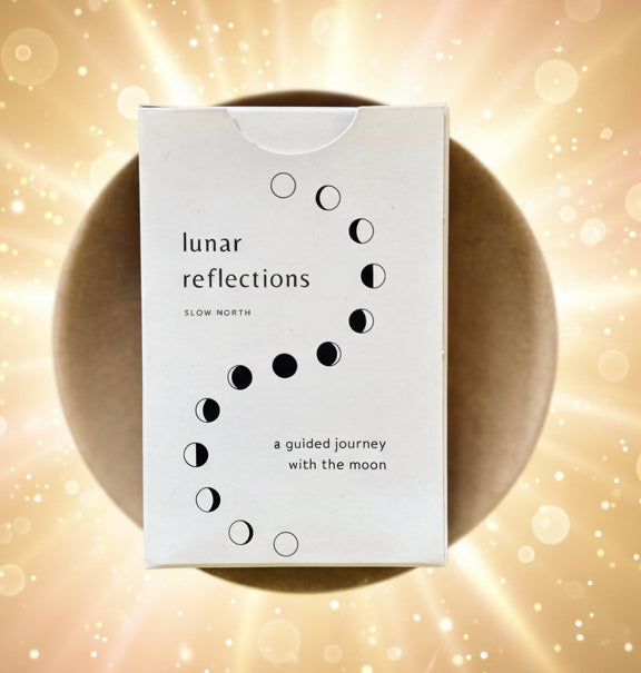 Box labeled 'lunar reflections' on a wooden surface