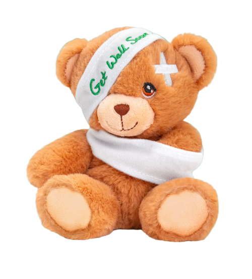 Teddy bear with a bandage and 'Get Well Soon' headband on a white background