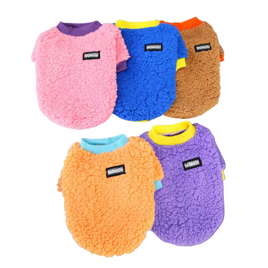 Five colorful fleece dog vests on a light gray background