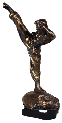 Bronze sculpture of a dancer on a black base next to a decorative lamp with floral design.