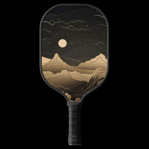 Pickleball paddle with mountain and moon design on a white background