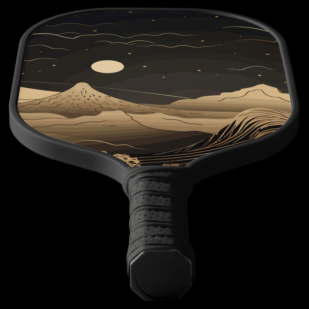 Pickleball paddle with a mountain landscape design on a black background