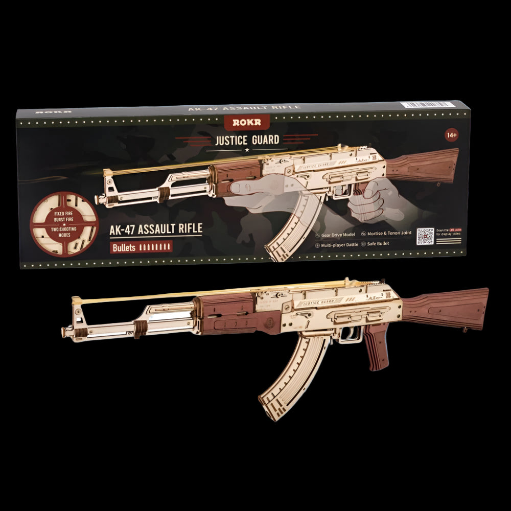 Wooden model of an AK-47 assault rifle in front of its packaging