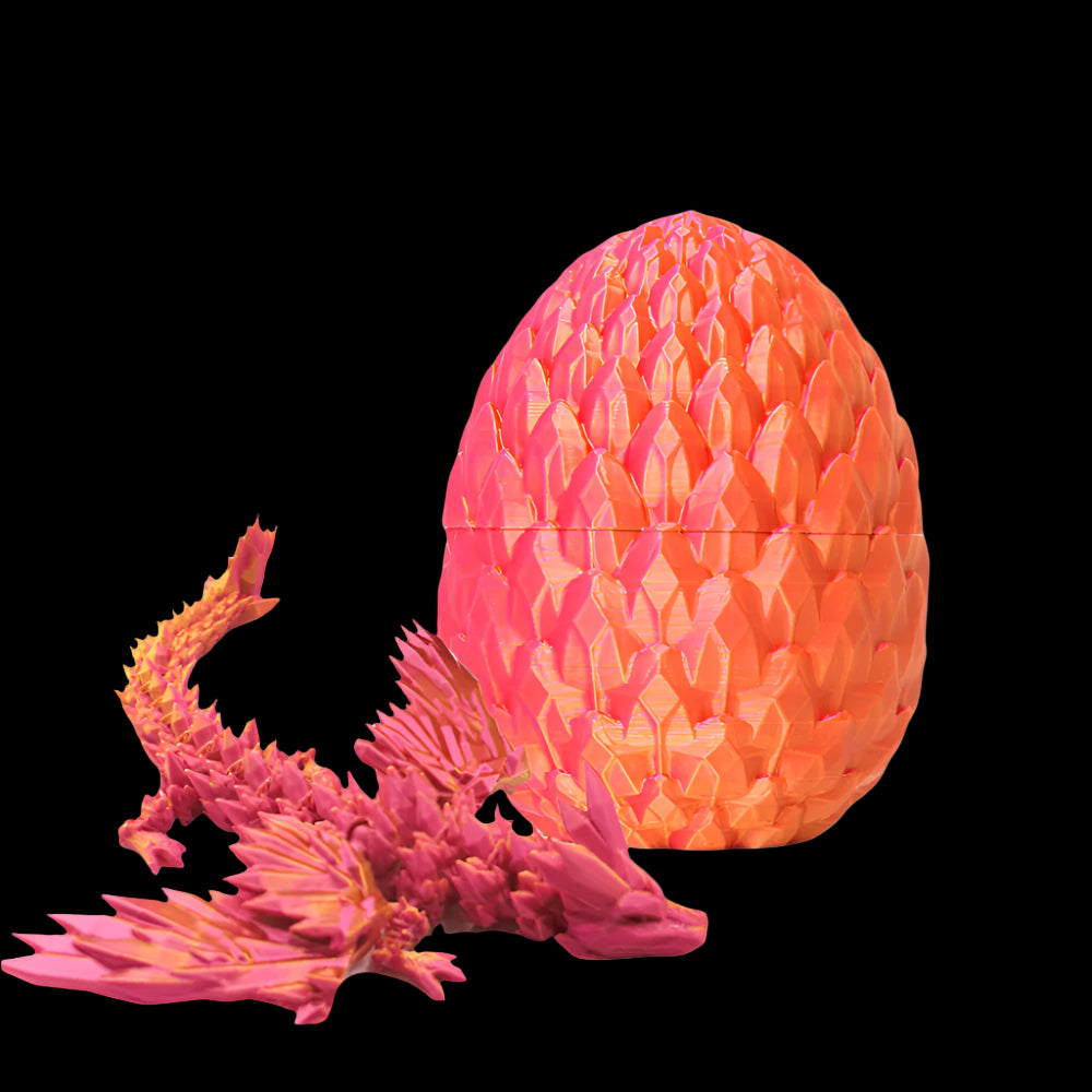 Pink and orange dragon toy with a matching egg on a white background
