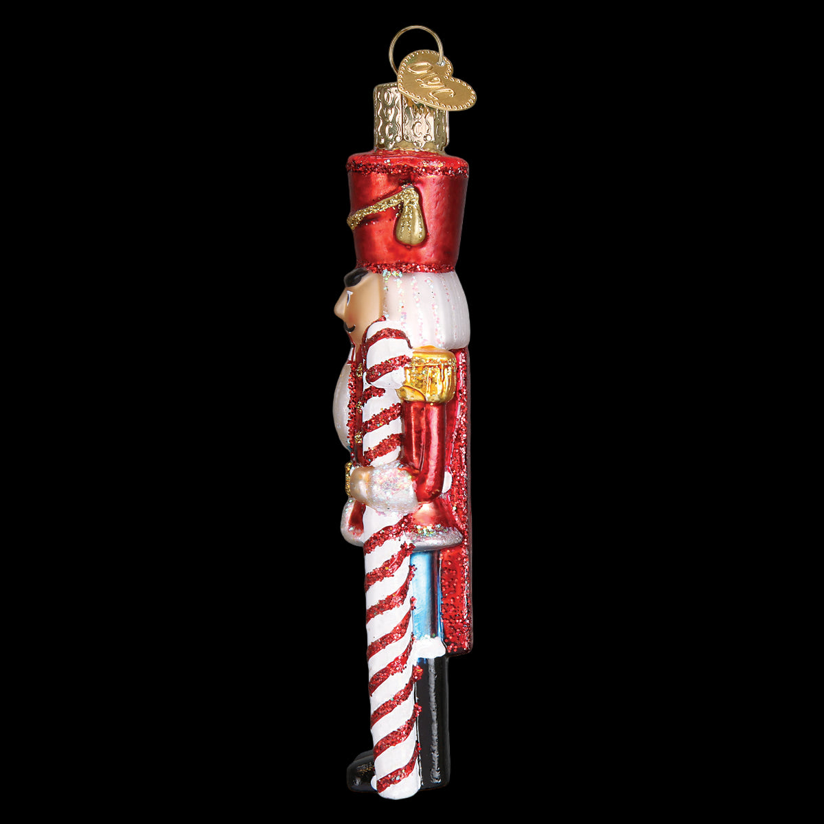 Decorative Christmas ornament shaped like a candy cane with a nutcracker figure on a white background