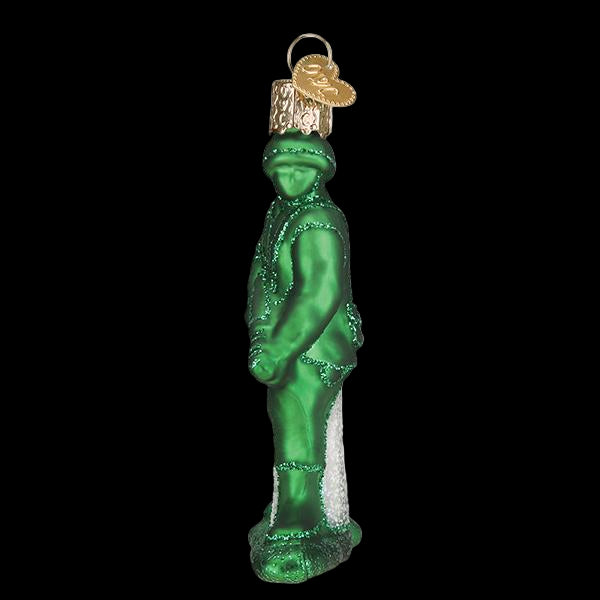 Green glass ornament of a soldier with a white beard on a white background
