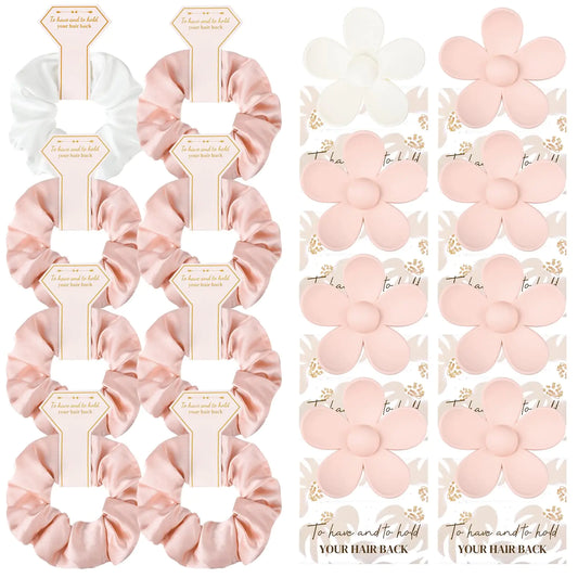Set of pink hair scrunchies with decorative packaging on a white background