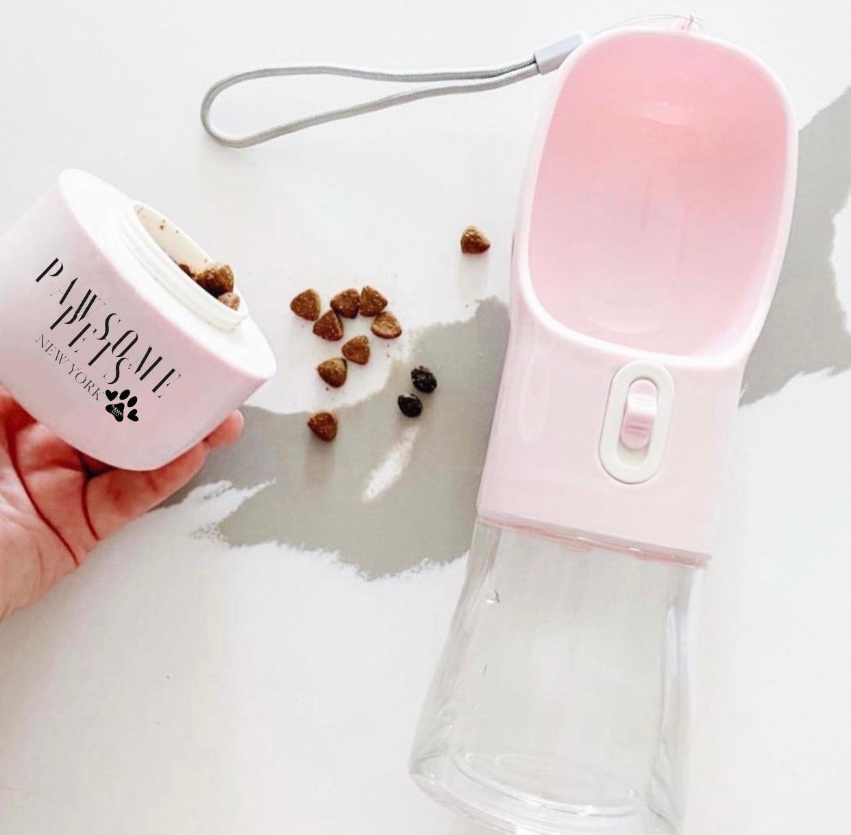 Pink pet water bottle and food container with pet treats on a light background