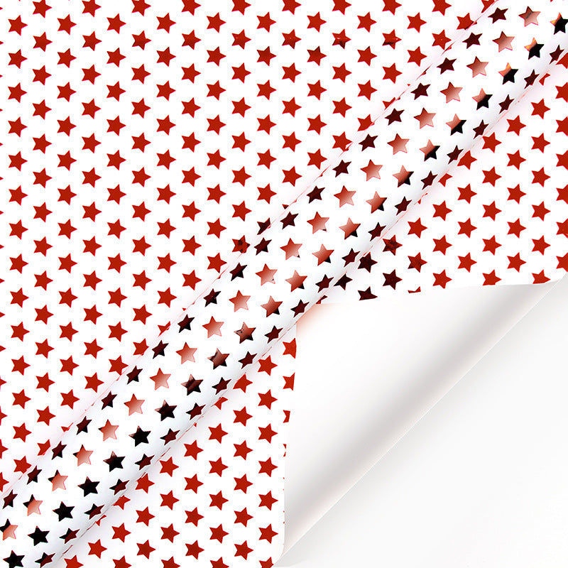 Pattern of red and black stars on a white background