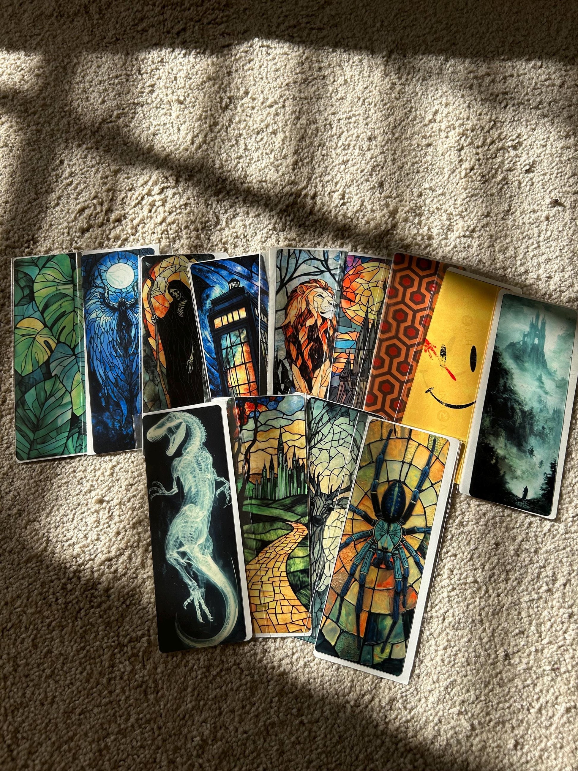 Collection of colorful tarot cards on a textured surface